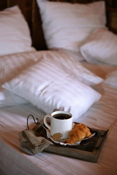 Wooden tray with light breakfast