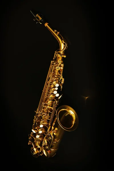 Beautiful golden saxophone on black background