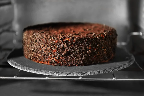 Chocolate cake in oven, close up