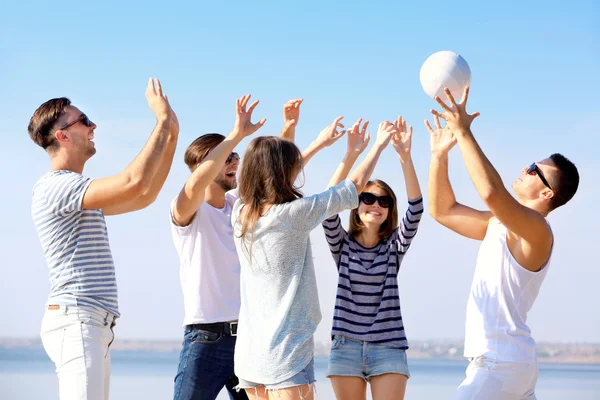 Young people playing with ball