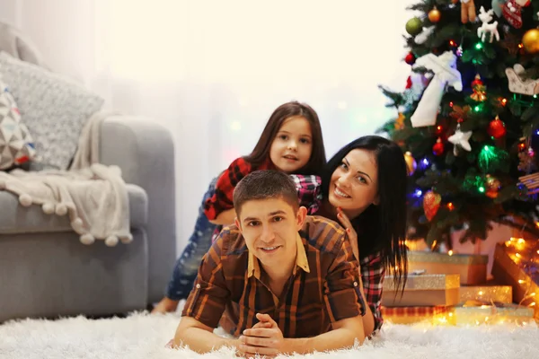 Happy family in decorated Christmas room