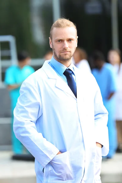 Handsome doctor with medical stuff