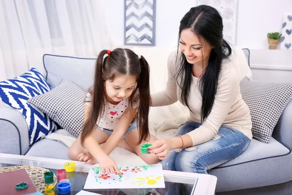 Mother and daughter playing