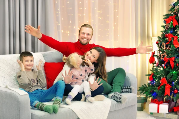 Christmas family in holiday living room