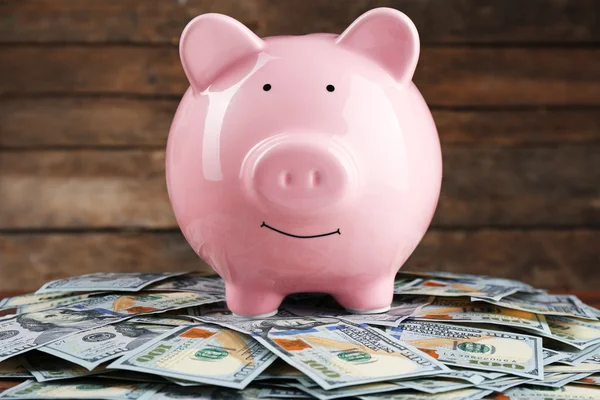 Pig money box and dollar banknotes