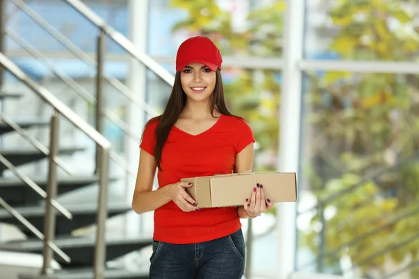 Delivery woman holding package