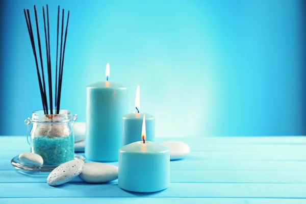 Spa composition of blue candles