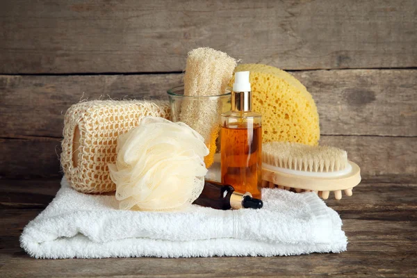 Variety of natural bath tools on wooden background