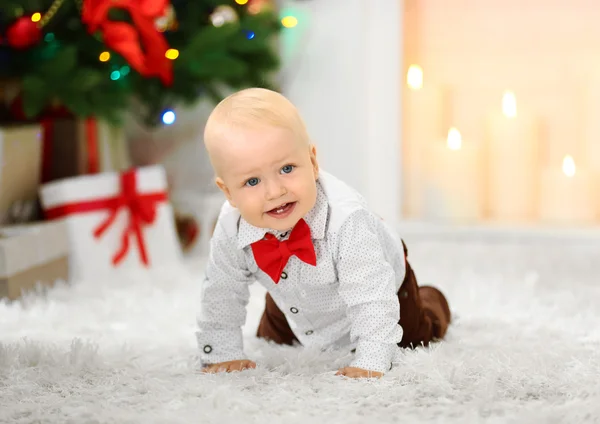 Funny baby on fluffy carpet