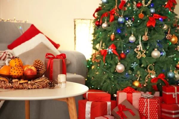 Christmas interior with fir tree, clock and gifts