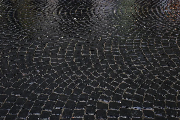 Wet stone pavement