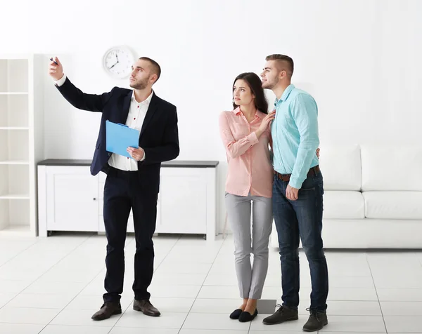 Happy family with estate agent