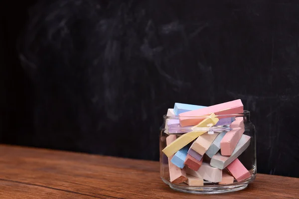 Glass jar with coloured chalk