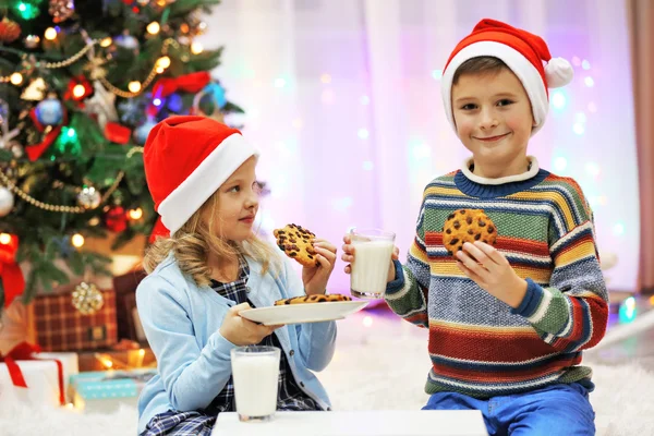 Happy children have meal on Christmas