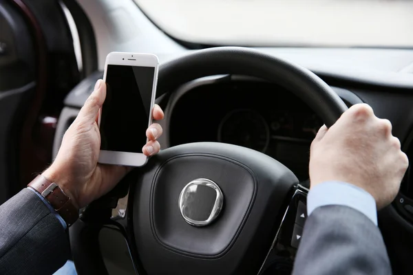Driver using smart phone in car