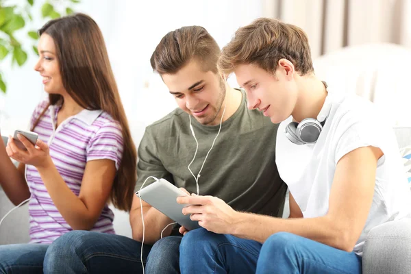 Teenager friends listening to music