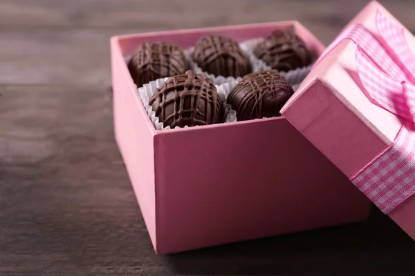 Tasty chocolate candies in pink gift box