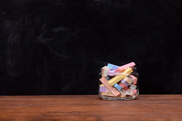 Glass jar with coloured chalk