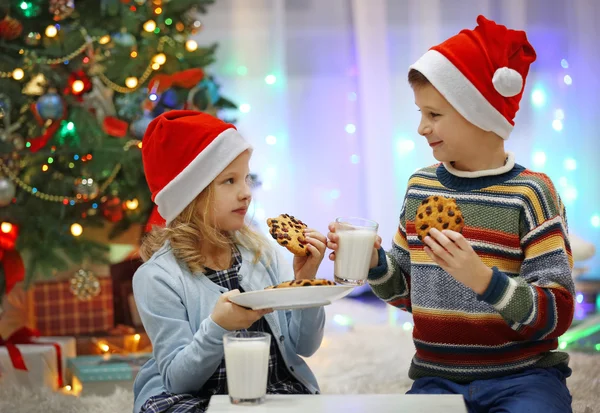 Happy children have meal on Christmas