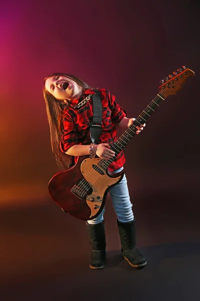 Little rock star playing guitar