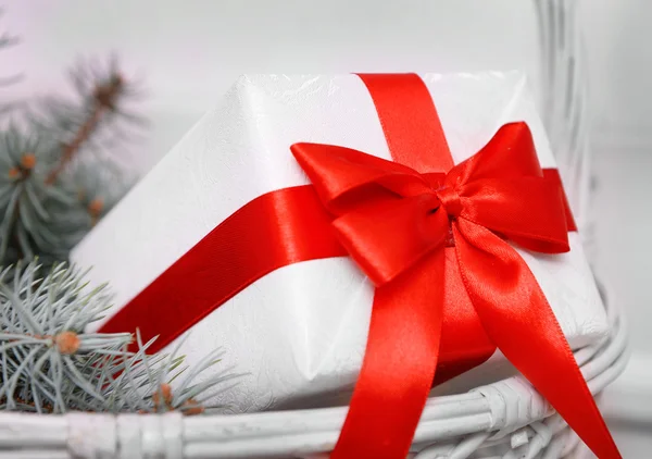White gift box with red bow