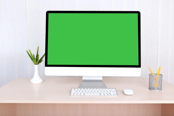 Modern computer with green screen