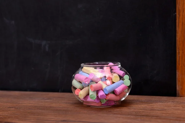 Glass jar with coloured chalk