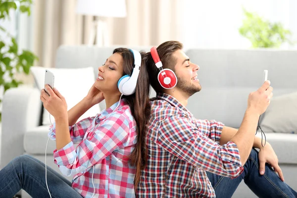 Teenager couple listening to music