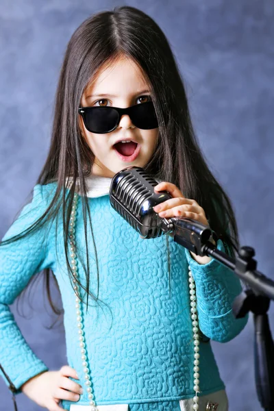 Super-star girl with microphone