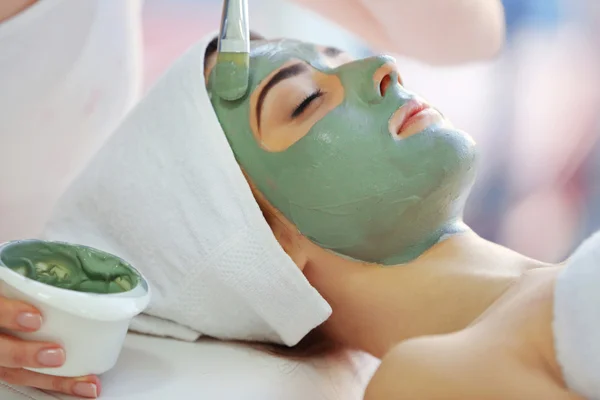 Young woman with nutrient facial mask