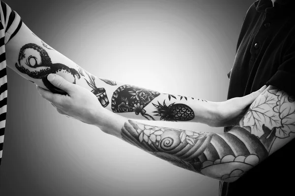Man\'s hands with tattoo
