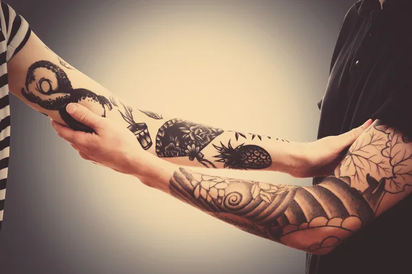Man\'s hands with tattoo