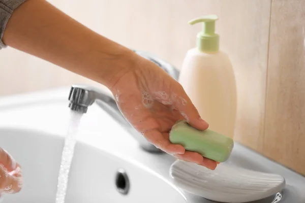 Washing of hands with soap