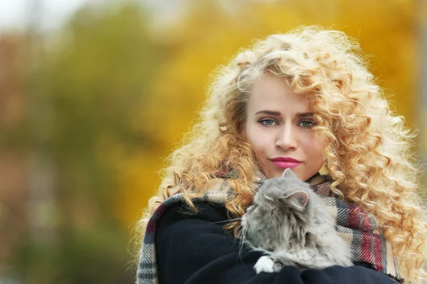 Woman and cat in the park