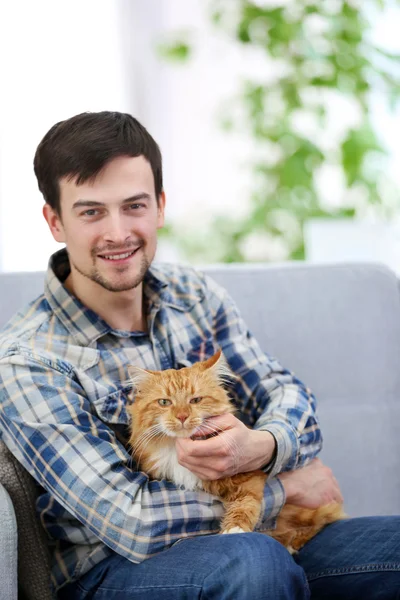 Man with fluffy cat