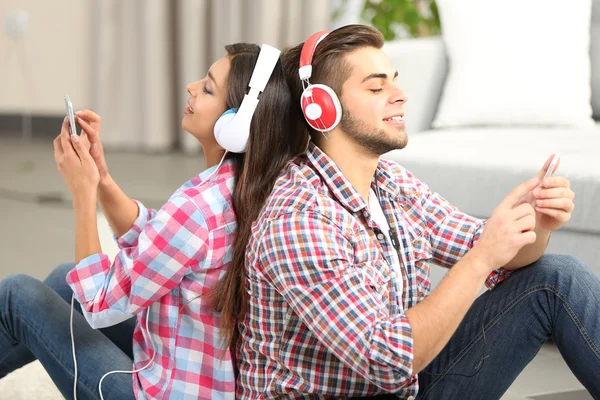 Teenager couple listening to music