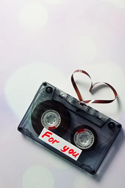 Audio cassette with magnetic tape