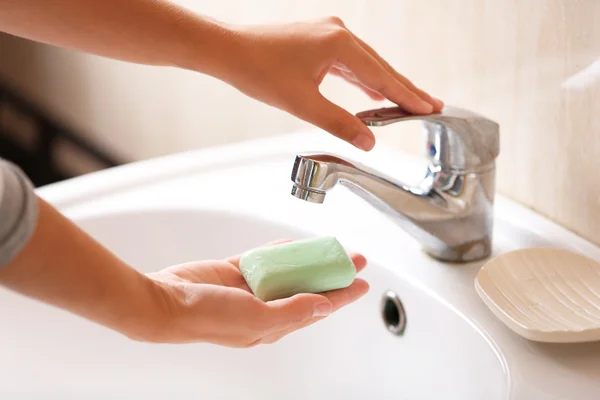 Washing of hands with soap