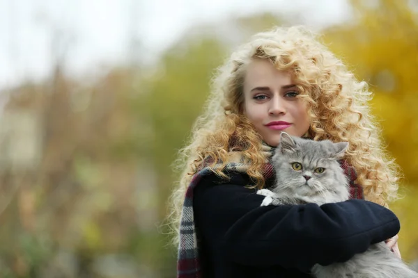 Woman and cat in the park