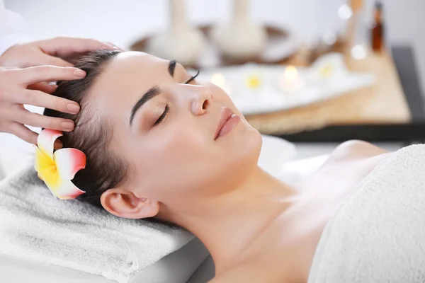 Woman relaxing with face massage
