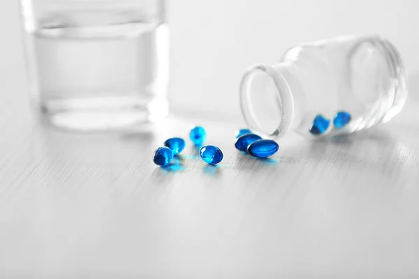 Capsules spilled from pill bottle