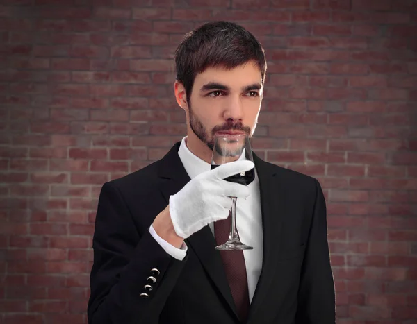 Man in suit with red wine