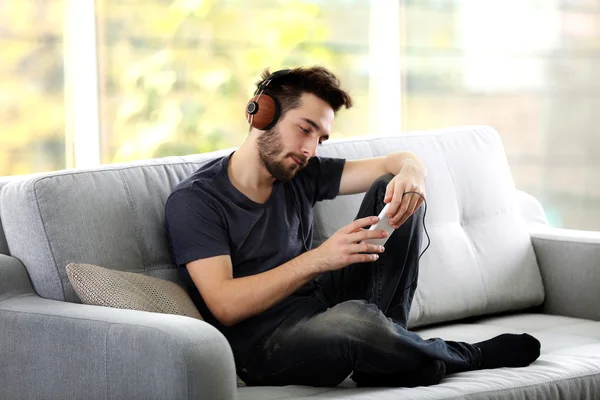Man listens music with headphones