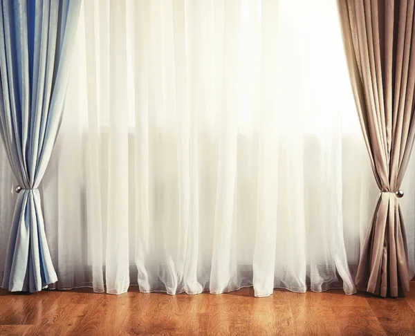 Empty room with curtain