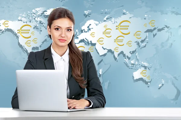 Business lady with laptop on world map