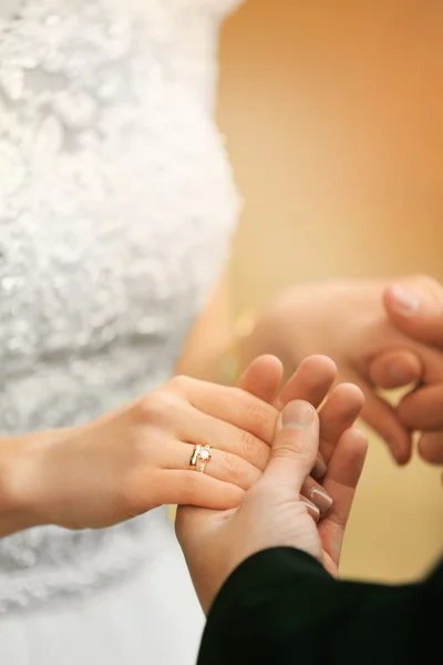 Bride and groom holding hands