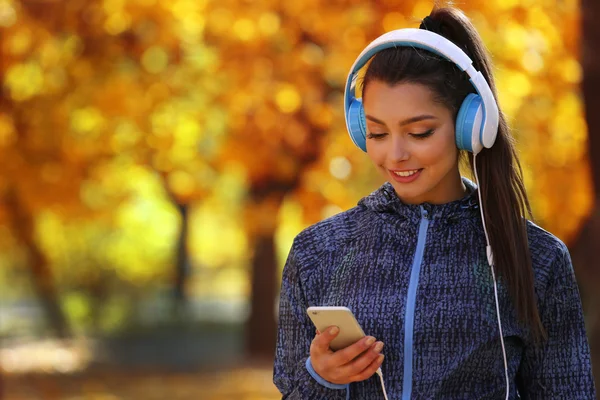 Young beautiful woman holding phone