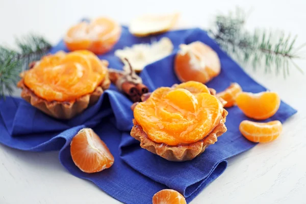 Sweet cakes with tangerines