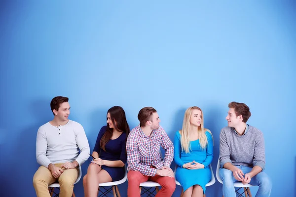 People sitting on chairs