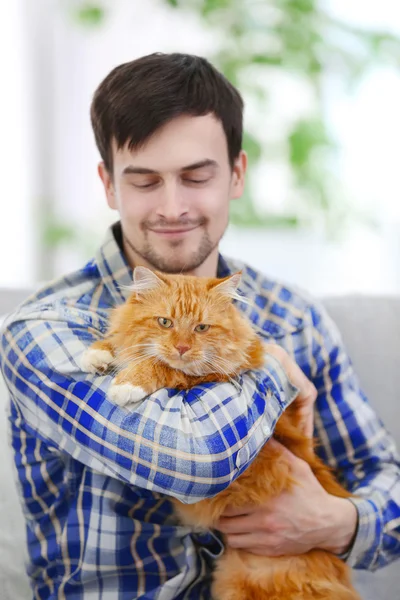 Man with fluffy cat